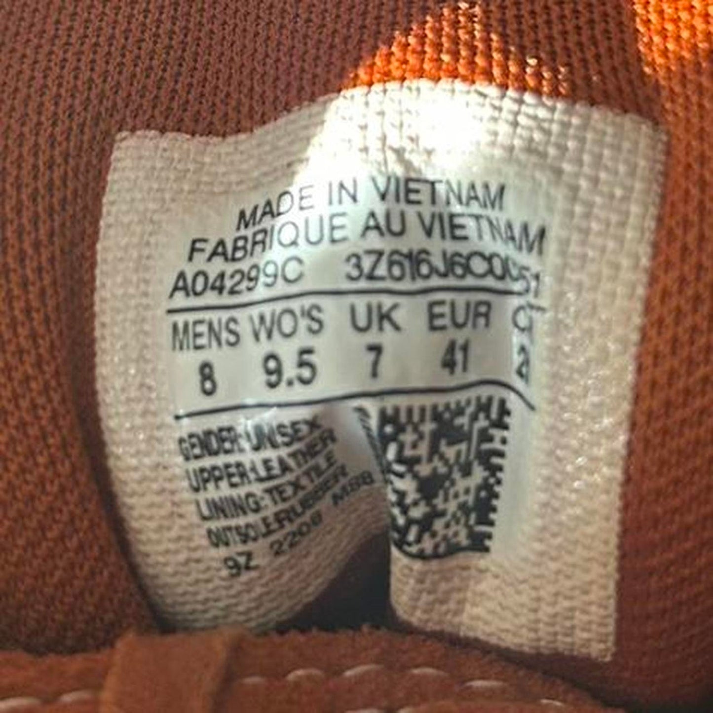 Orange and white converse run star