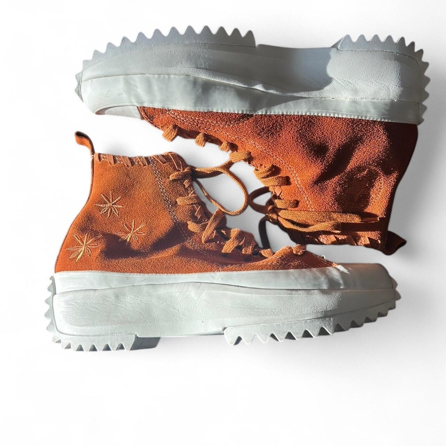 Orange and white converse run star