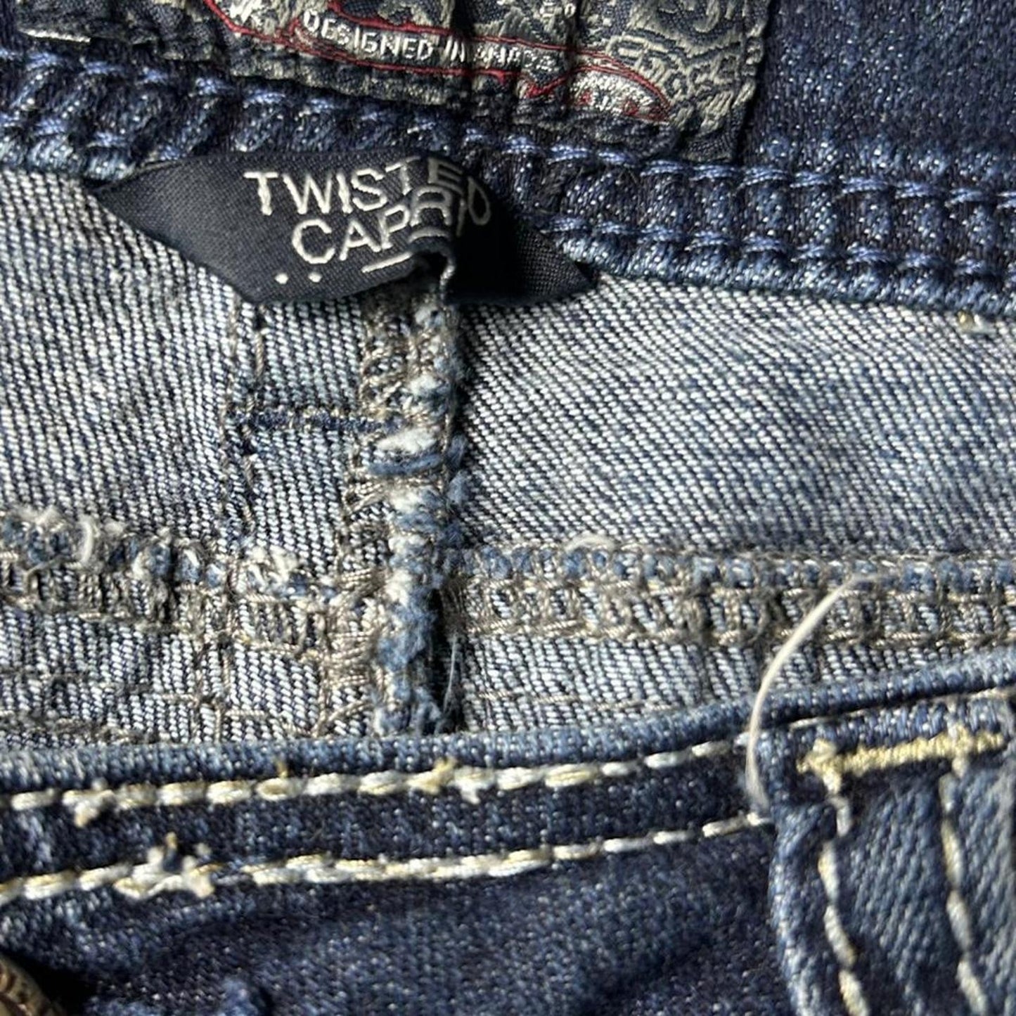 Silver size 32x26 Navy blue capri jeans with a distressed, faded look