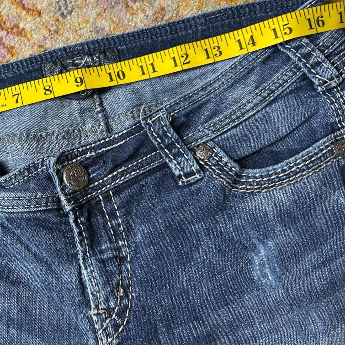 Silver size 32x26 Navy blue capri jeans with a distressed, faded look