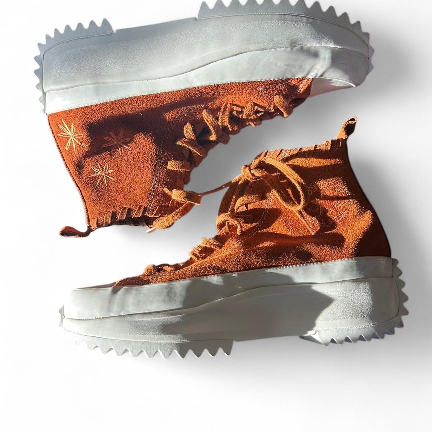 Orange and white converse run star