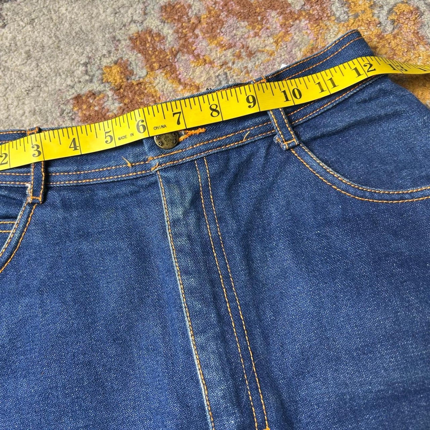 Gitano size 25x21 dark wash knee length skirt with topstitching and slit in back