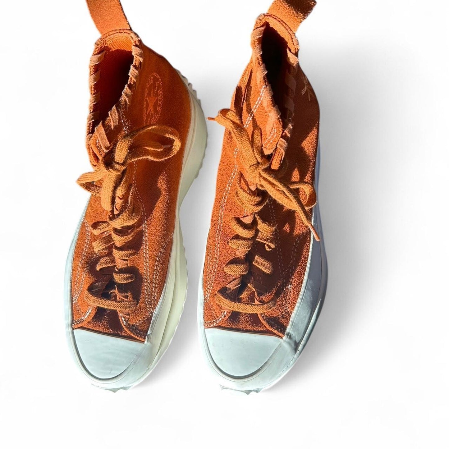 Orange and white converse run star