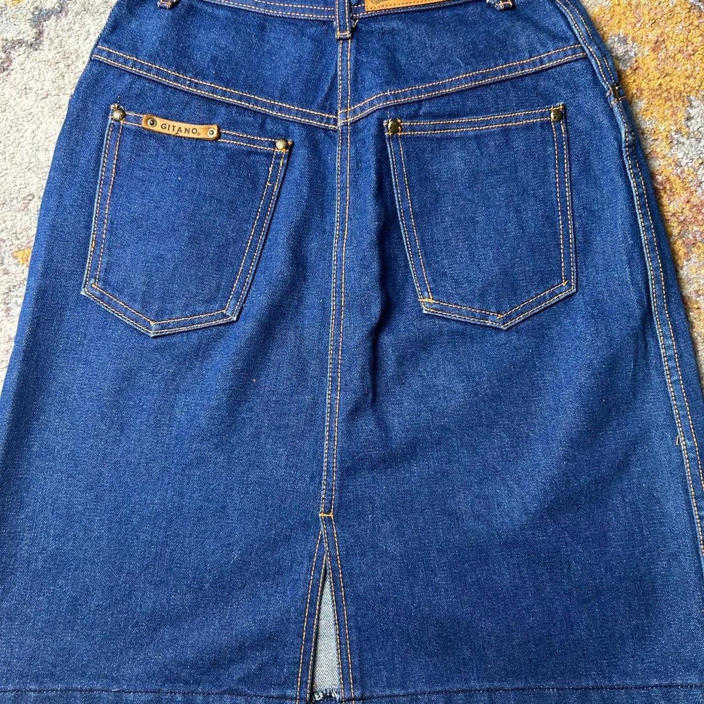 Gitano size 25x21 dark wash knee length skirt with topstitching and slit in back