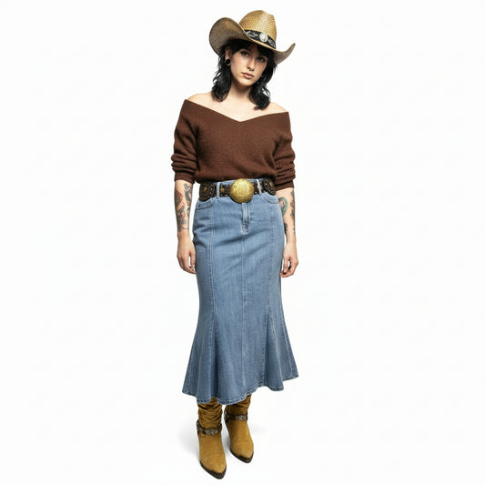 Cowboy hat, brown sweater, yellow boots, blue jeans with a decorative belt on a white background
